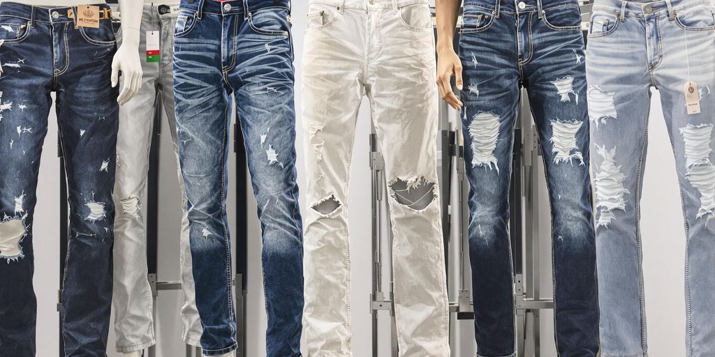 Variety of men's jeans styles on display.