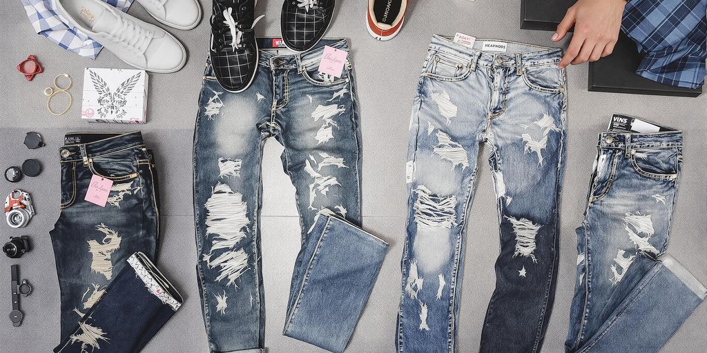 Men's ripped jeans in various styles and washes.